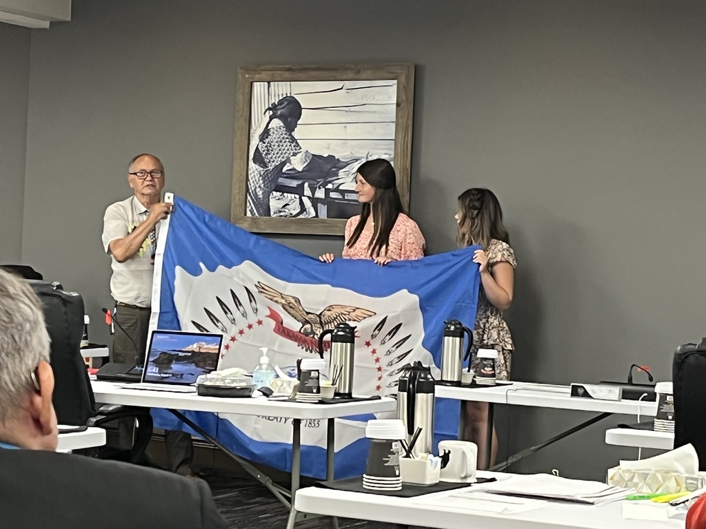 Chairman Sahluskin of the Yakama Nation presenting a flag to CERHS students at Tribal Council