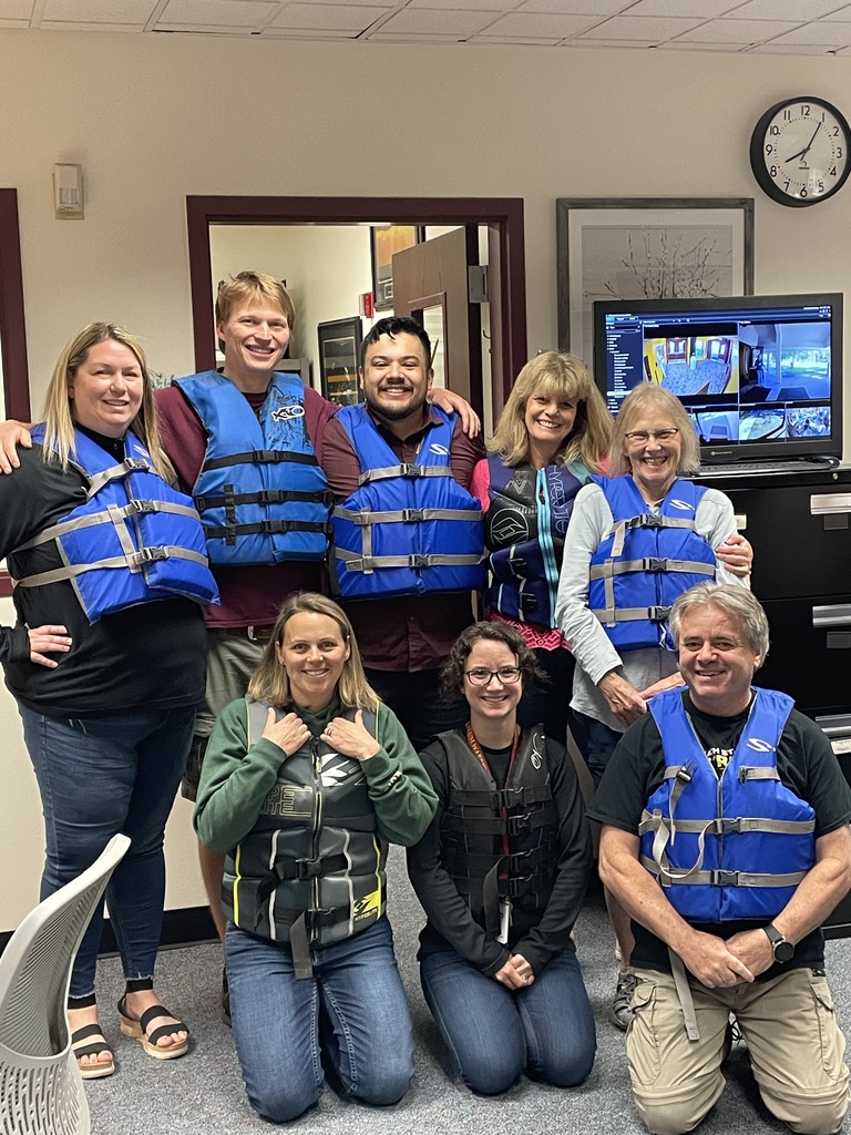 Staff wearing lifejackets to promote water safety